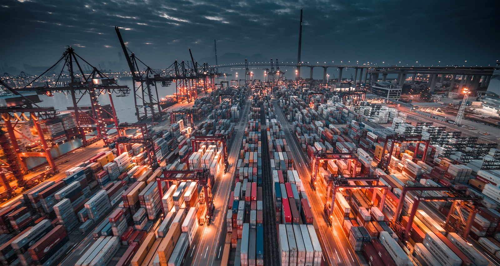 Container port at dusk — end-to-end logistics